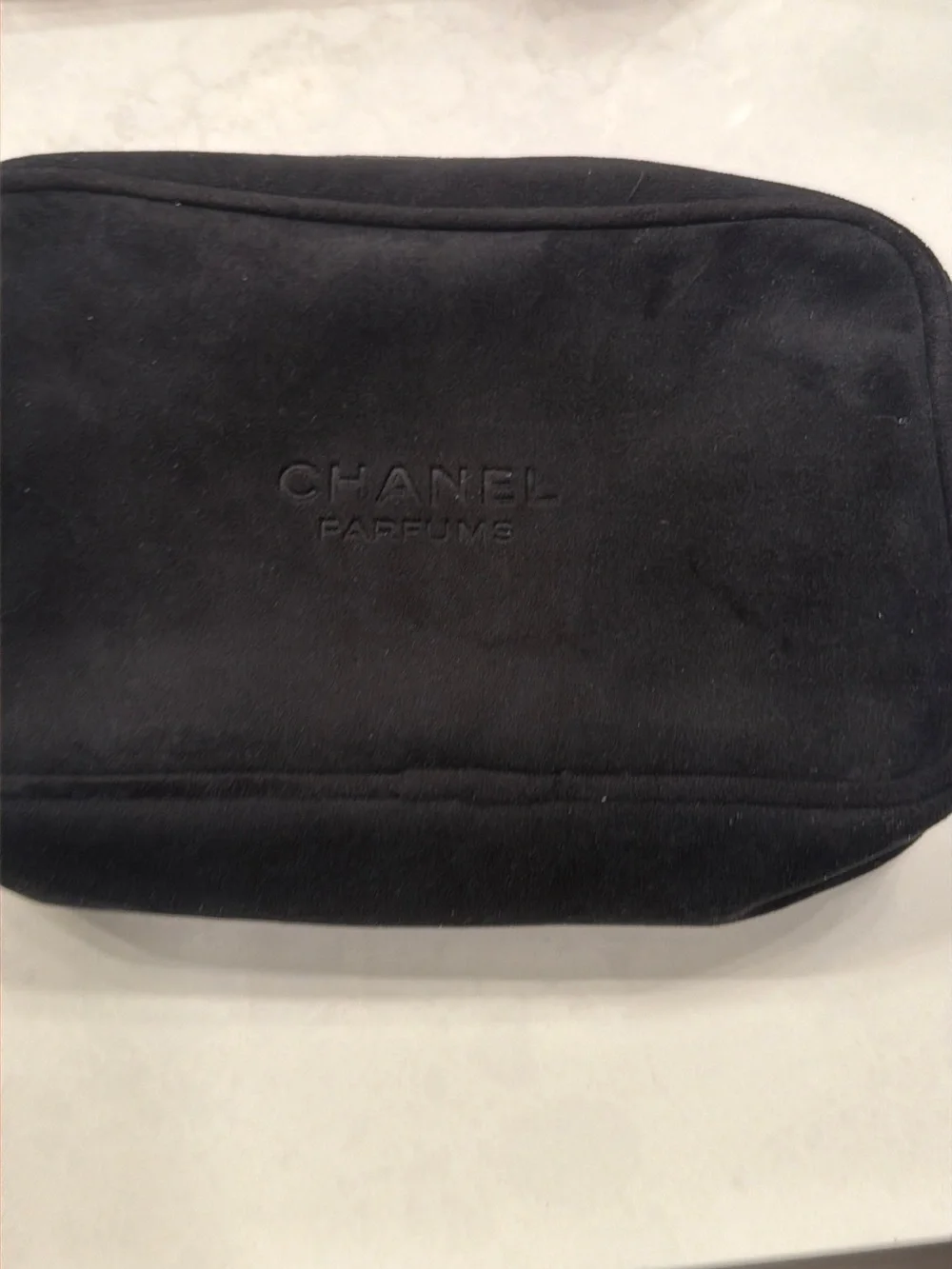 CHANEL Black Suede Cosmetic Pouch with Embossed Logo
